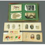 An early 20th century postcard album, containing a quantity of Great War period silk postcards,