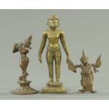 A Chinese carved wooden figure of a deity, and three further Eastern brass figures. Tallest 36 cm.