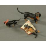 A set of three miniature cold painted bronze dachshunds, after Franz Bergman, 20th century,