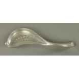 A Tudric pewter crumb scoop, circa 1910, designed by Archibald Knox,