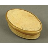 An 18th century horn snuffbox, oval. Length 70 mm.