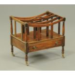 A mahogany Canterbury, with centre carrying handle,