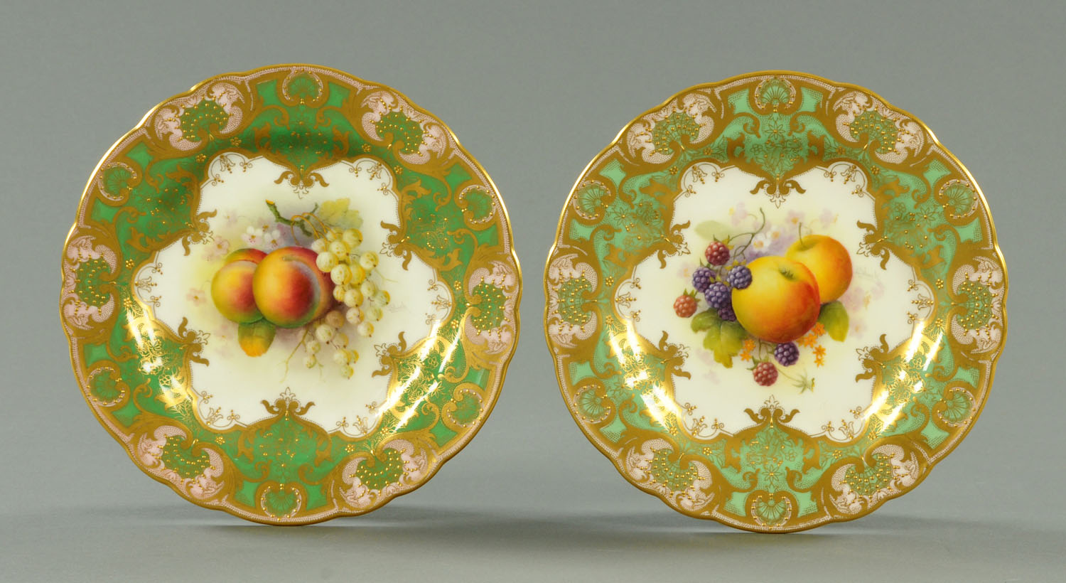 A pair of Royal Worcester handpainted cabinet plates, date codes for 1919 and 1920, each signed "A.