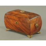 A Regency mahogany tea caddy, of bombe form, with brass fittings and bracket feet.