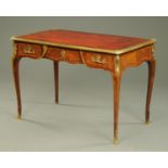 A fine 19th century walnut bureau plat, with red tooled leather writing surface and ormolu mounts,