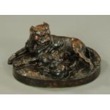 W. Wolfe, a bronze figure group of a dog with pups. Length 35 cm, signed.