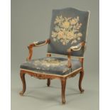 An Edwardian mahogany Gainsborough style chair, with upholstered back, padded arms,