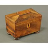 A mahogany miniature tea caddy, mid 19th century, with boxwood stringing and escutcheon,