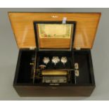 A late 19th century Swiss musical box, in simulated rosewood case, playing eight airs,