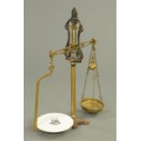 A large set of Victorian brass and iron shop scales. Height 99 cm (see illustration).