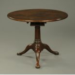 A Georgian mahogany tripod table, with circular top, snap action,