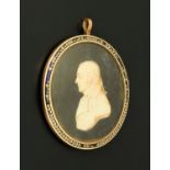 A Georgian portrait profile miniature on ivory, a notable gentleman facing left,