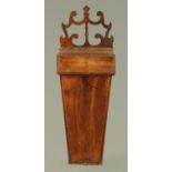 A 19th century mahogany candle box, with fretwork hanger. Width 21 cm.