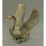 A brass model of a swan taking flight. Height 65 cm.