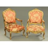 A pair of French style gilt painted open armchairs,