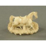 A carved ivory tie ring, late 19th century,