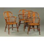 A set of four 19th century yew wood Windsor armchairs, typical form, with pierced splat backs,