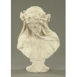 A reconstituted marble bust of a veiled female figure. Height 41 cm.