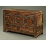 An 18th century oak three panelled coffer,