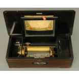 A late 19th century Swiss musical box, simulated rosewood, playing eight airs, paper label. 15.