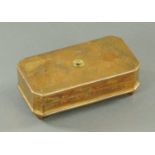 A gilt brass taper holder, 19th century, rectangular form, with canted corners,