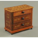 A Campbell Brown of Carlisle miniature chest of drawers, gentleman's outfitter. Width 26.5 cm.