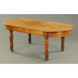 A 19th century French walnut library table, with breakfront,