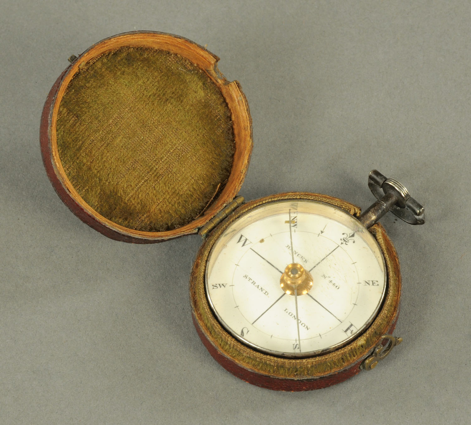 A George III pocket compass, by Robert Bancks, the plated body with enamel dial inscribed "Bancks,