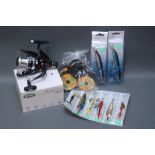 A Mitchell Avocet 6000 reel, four spools of bulk line and 8 assorted carded lures.