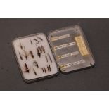 A fly box containing Frank Sawyer trout flies, to include The Sawyer Swedish, Sawyer killer bug,