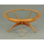 A G-Plan teak Astro spider coffee table, designed by Victor Wilkins, with glass top.