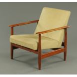 A teak armchair, circa 1950's/1960's, upholstered in Rexine.