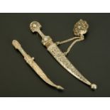 A Russian silver and niello paper knife, and a knife and scabbard bar brooch. Longest 13.5 cm.