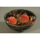 A William Moorcroft Pomegranate Leaf & Berry bowl, early 20th century,