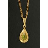 A 9 ct gold peridot pendant, with 9 ct gold chain, gross weight 4.3 grams.