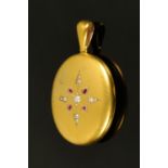 A late Victorian locket, set with seed pearls and garnets.