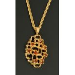 A 9 ct gold pendant, set with amber coloured stones and with 9 ct gold chain, 6 grams gross.