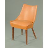 A 1960's G-Plan upholstered chair, with Rexine cover and raised on tapered legs of square section,