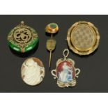 A silver mounted enamelled pendant, a Tibetan jade pendant with dragon motif,