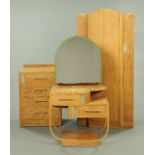 An Art Deco limed oak bedroom suite, comprising wardrobe, chest of drawers,