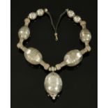 An African white metal necklace, mid 20th century,