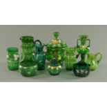 A collection of Victorian emerald green and enamelled glass ware, comprising six jugs, two bowls,