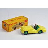 Dinky Toys No.105 Triumph TR2 Sports Car. Pale yellow body, light green interior with driver;
