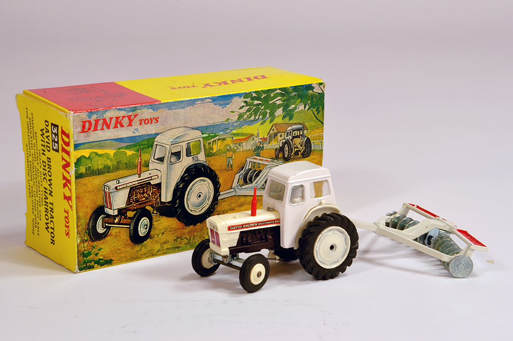 Dinky No. 325 David Brown Tractor with Disc Harrow. A fine example is NM in E Box.