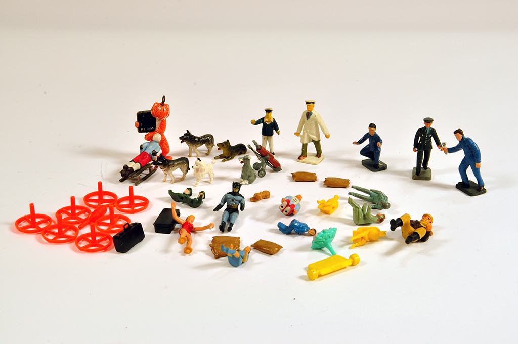 An interesting assortment of original corgi figures and accessories including batman, dogs and