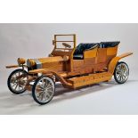 An exceptionally well built wooden scale model of a Rolls Royce Silver Ghost. Approx 110 cm. Circa