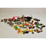 Large group of plastic and diecast vehicles comprising various makers, mostly motorbikes and