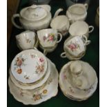 A collection of Royal Crown Derby tea wares decorated with floral sprays on a white ground,