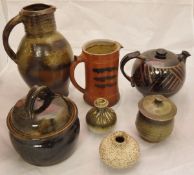 A collection of studio pottery wares including a Sven D Bayer jug with three fish design,