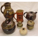 A collection of studio pottery wares including a Sven D Bayer jug with three fish design,